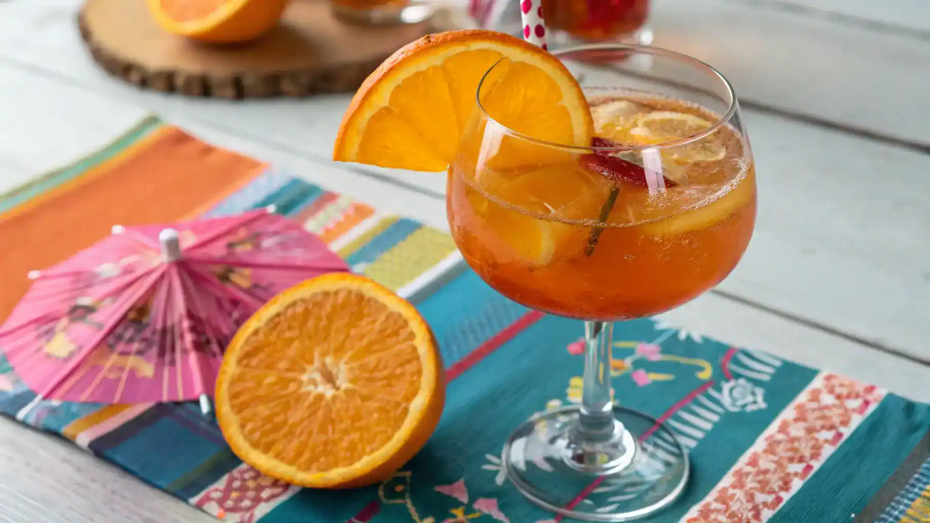 A refreshing glass of orange liqueur garnished with an orange slice.